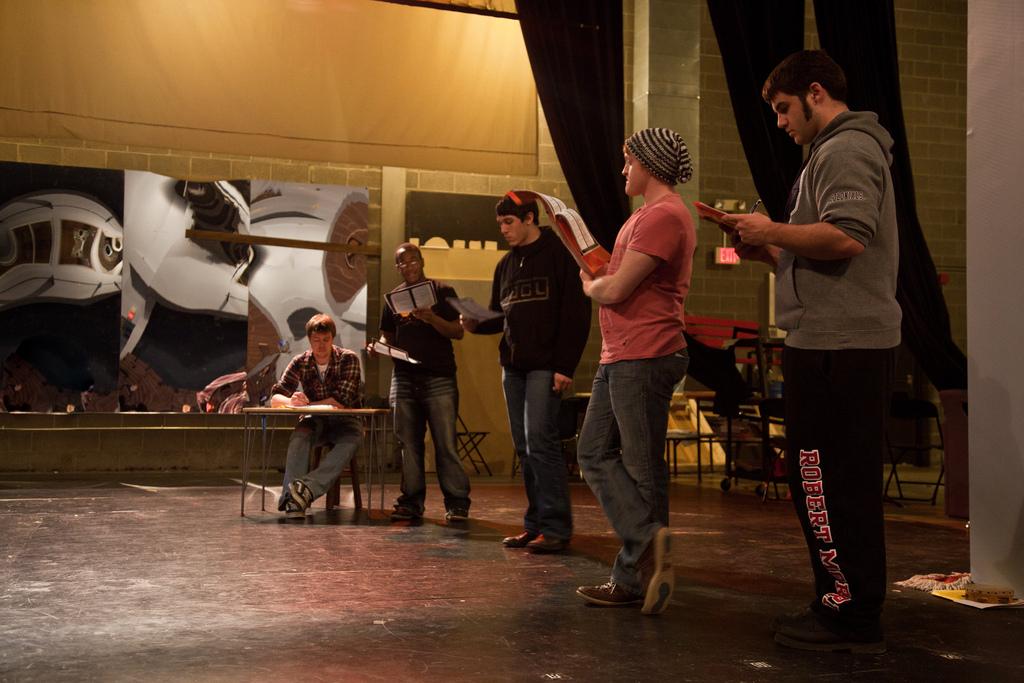 Students practice their lines during rehearsal for The Crucible. 