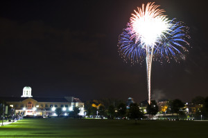 Nicholson Center on the left, Blue, red, and white firework on the right, from a wide camera view