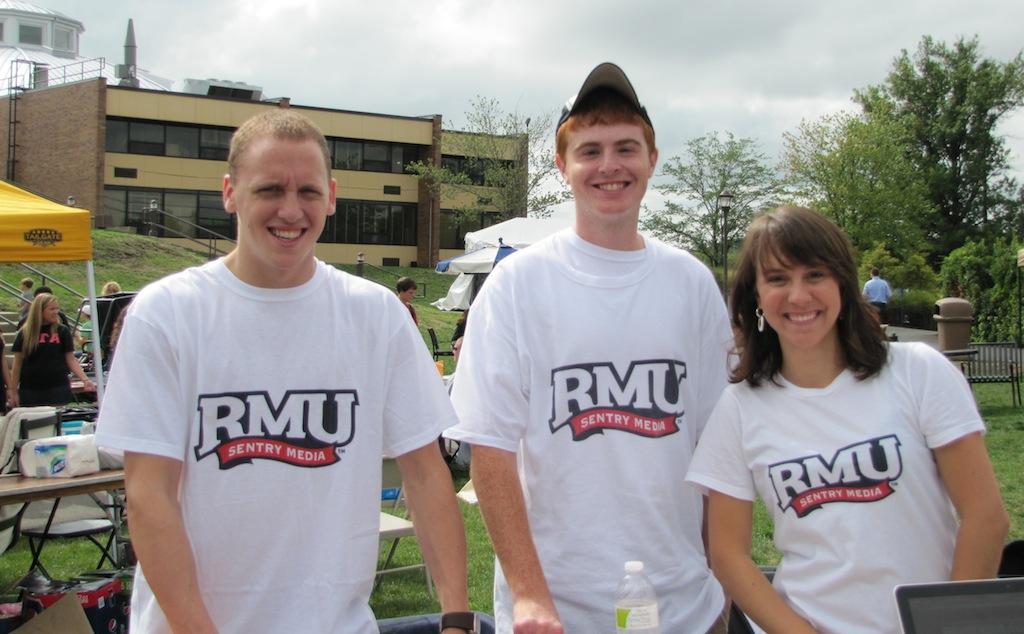 RMU+Sentry+Media+staff+members+model+the+T-shirts+raffled+off+at+the+Activities+Fair+Wednesday.