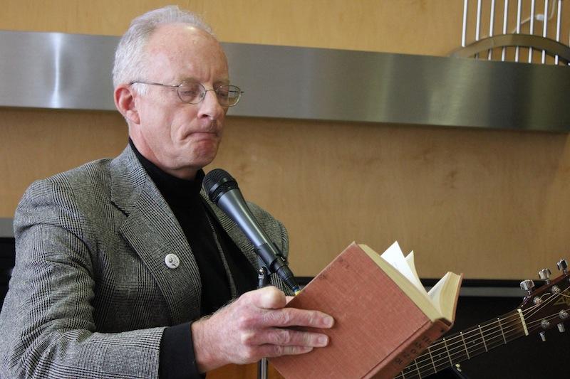 Dr. John Lawson reading to the group. 