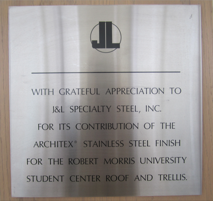 The+roofs+on+certain+buildings+on+campus+showcase+J%26amp%3BL+Steel.++This+plaque+is+located+in+the+Nicholson+Center+near+Romos+Cafe.