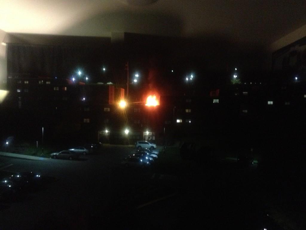 View from Lexington Hall of dumpster fire behind Washington Wall