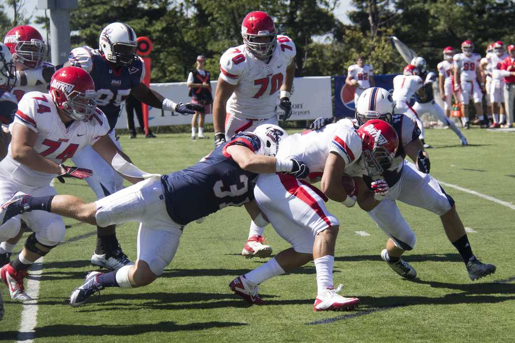 Cook (31) making one of his 19 tackles in RMUs 21-14 loss to Dayton