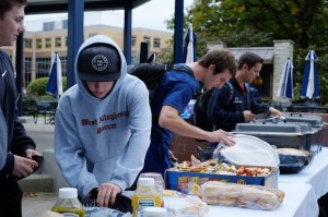 Students enjoying free food at De La Gente. 