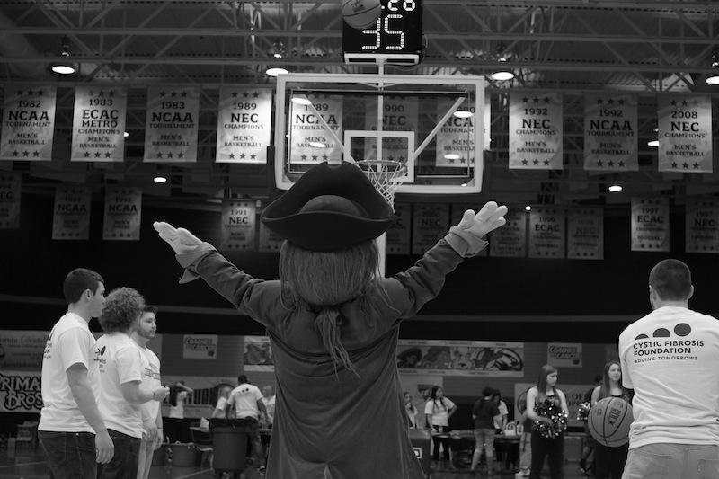 Romo, competing in a free throw competition with Greg DellOmo