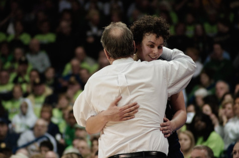 Head coach Sal Buscaglia hugging Artemis Spanou as she walked off the floor for the final time in a RMU uniform. 