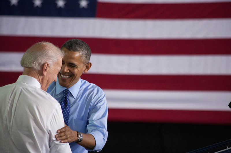 President and Vice President greeting each other on stage before the excited crowd. 