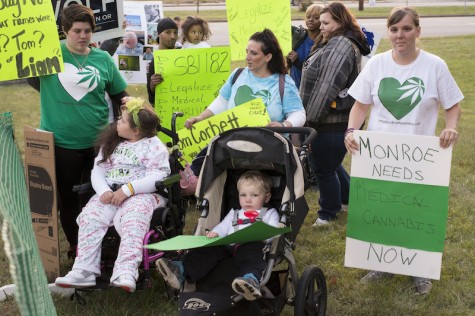 Supporters of Tom Wolf outside WTAE station Wednesday night, holding signs in support of legal, medical marijuana. 