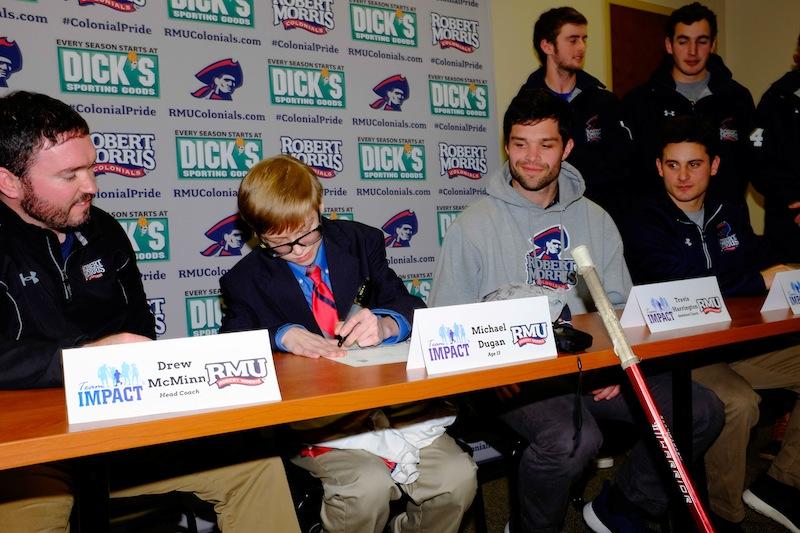 With+the+help+of+Team+IMPACT%2C+13-year-old+Mikey+Dugan+was+drafted+by+the+Robert+Morris+lacrosse+team+during+a+press+conference+on+Feb.+6.+