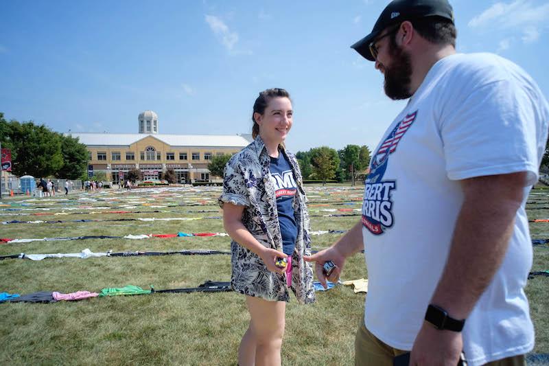 RMU+students%2C+lead+by+Merritt+Donoghue%2C+set+the+world+record+Saturday+August+28th+for+longest+chain+of+teeshirts+tied+together.+Students+worked+from+10%3A00+AM+to+1%3A00+PM+to+create+a+6372+ft+51%2F2+in+chain+of+teeshirts+consisting+of+2534+individual+teeshirts.+The+shirts+will+be+donated+to+a+local+homeless+shelter.+