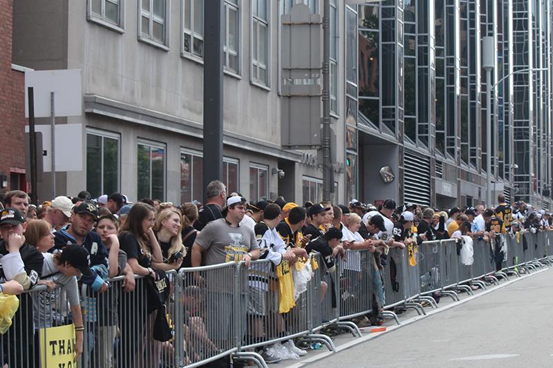 Sidewalks fill to capacity as an estimated 3,500 fans anticipate the start of the parade.