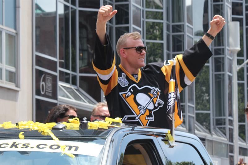 Patric Hornqvist, who scored the empty-net goal to solidify the Penguins Game 6 victory, raises his arms to the roar of the crowd.