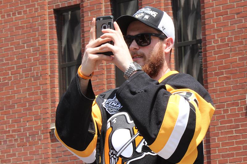 Rookie Tom Kuhnhackl takes videos of the fans.