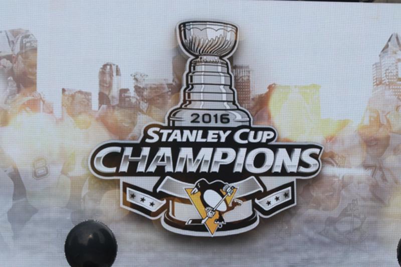 The parade screen graphic celebrates the Penguins Stanley Cup victory.