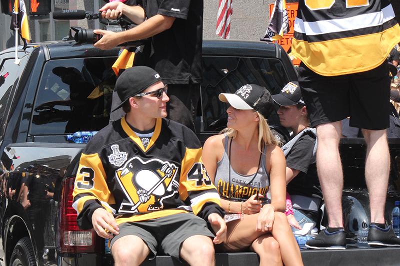 Rookie Conor Sheary (43) looks into the crowd as he sits in the bed of a truck.