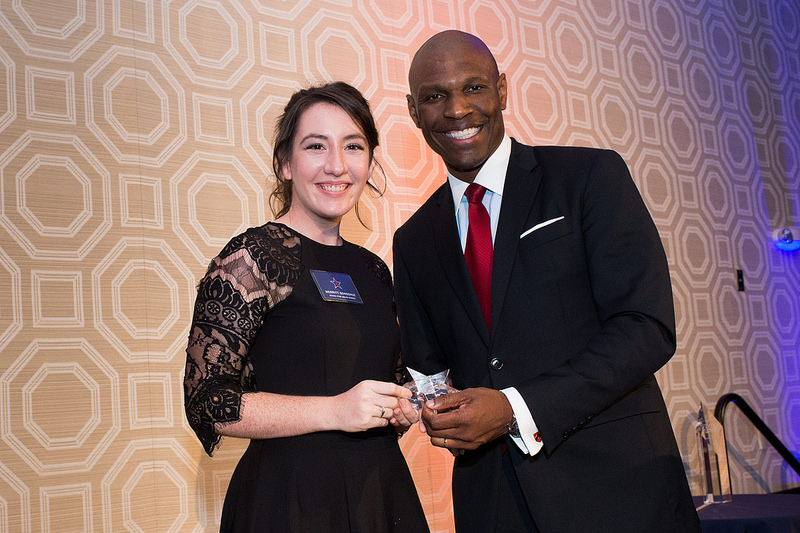 Merritt Donoghue receives the Rising Star Award from RMU President Christopher B. Howard at the Presidents Council Dinner in Pittsburgh, Thursday, Oct. 6, 2016. (RMU Photo/Joe Appel)