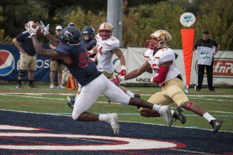 Reggie Green pulls in his first career touchdown grab as a Colonial in the first quarter against VMI Photo credit: Katey Ladika