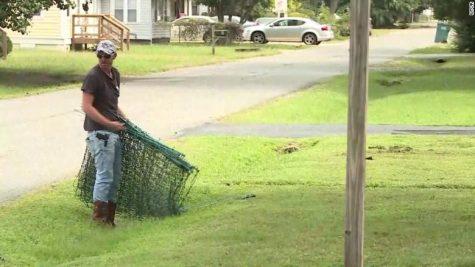 Man builds electric fence inches from school bus stop to keep kids off lawn