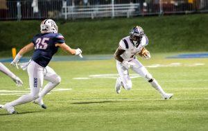 Terence Stephens runs against Duquesne. Photo credit: David Auth