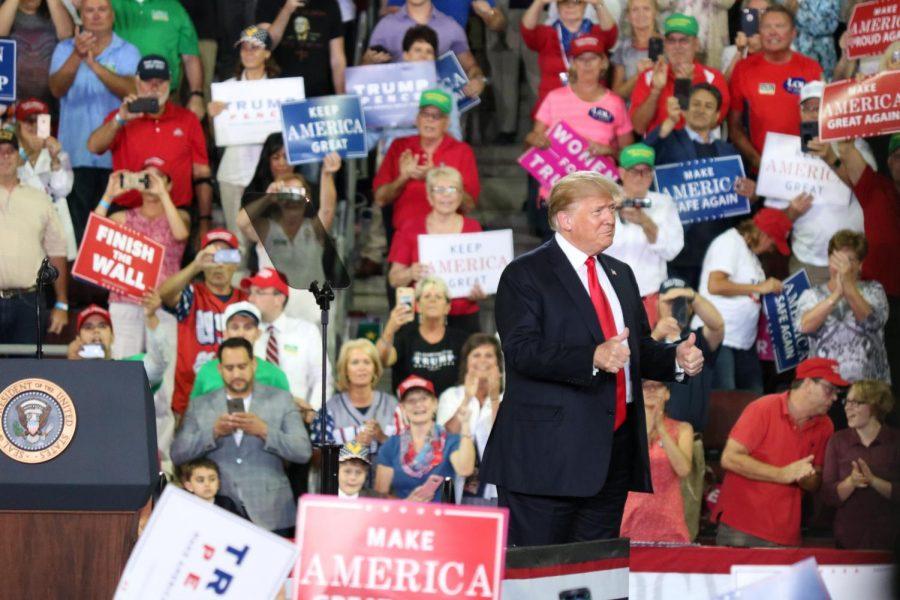 President Donald Trump gives the crowd a thumbs up for the thousands of people at the Erie Insurance Arena in Erie, Pennsylvania on October 10, 2018.
