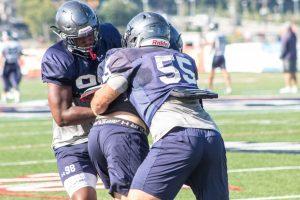 Sophomore lineman Frank Antuono makes the tackle during practice. Moon Twp, PA. August 24, 2018 (RMU Sentry Media/Samuel Anthony)