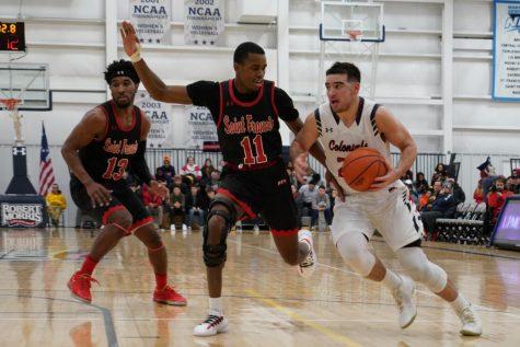 MOON TOWNSHIP — Matty McConnell drives to the hoop against Saint Francis on January 31, 2019 (Tim Kelly/RMU Sentry Media).