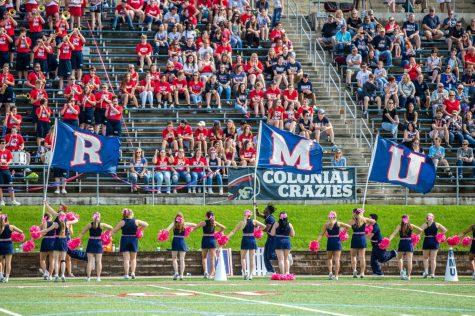 Cheerleaders lead the Colonial Crazies in a cheer. (David Auth/RMU Sentry Media) Photo credit: David Auth
