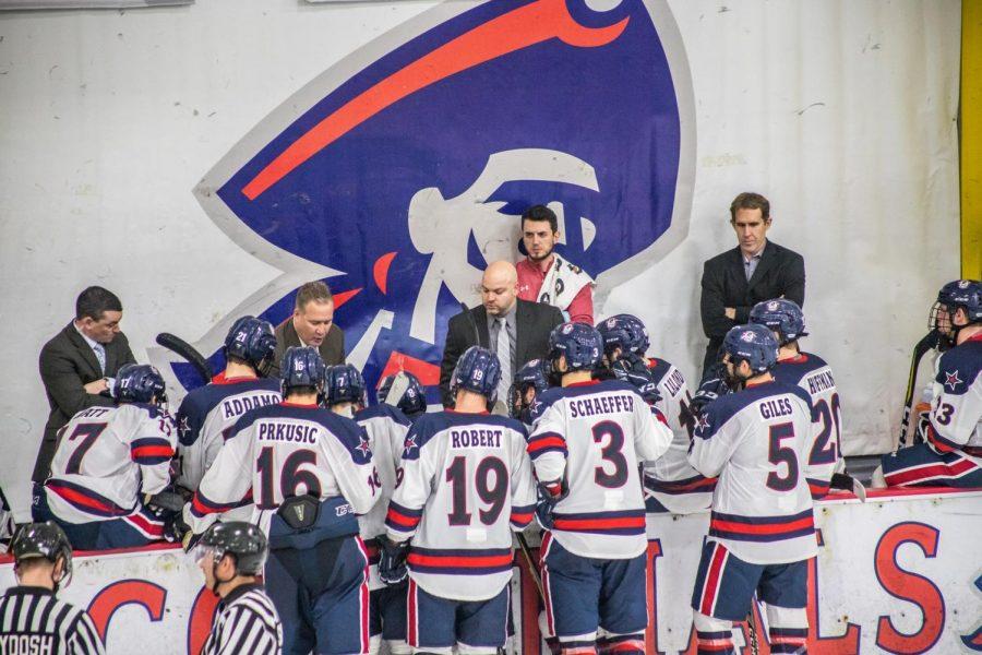 The+Robert+Morris+mens+hockey+team+discusses+a+play+during+a+game+against+Niagara+Nov.+2%2C+2018.+%28David+Auth%2FRMU+Sentry+Media%29+Photo+credit%3A+David+Auth