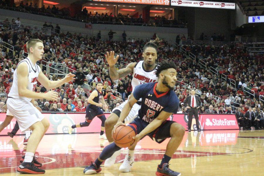 Sayveon McEwen looks for a pass against Louisville on Dec. 21, 2018 (Alex Temple/RMU Sentry Media). Photo credit: Alex Temple