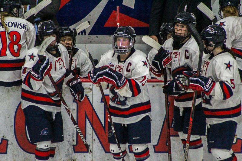 PITTSBURGH -- The womens hockey team rests during a break against St. Lawerence on September 29, 2018. (Samuel Anthony/RMU Sentry Media).