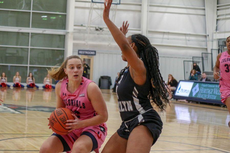 Esther Castedo drives the lane before kicking out a pass to a teammate. Moon, PA Feb. 25, 2019. (RMU Sentry Media/Michael Sciulli)