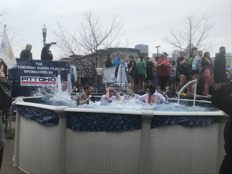 Plungers jump into the cold water during the 2019 Pittsburgh Polar Plunge. Photo Credit: (RMU Sentry Media/Adelyn Berdine)