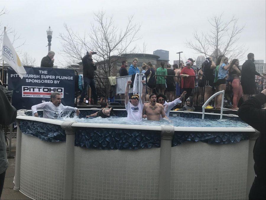 Plungers jump into the cold water during the 2019 Pittsburgh Polar Plunge. Photo Credit: (RMU Sentry Media/Adelyn Berdine)