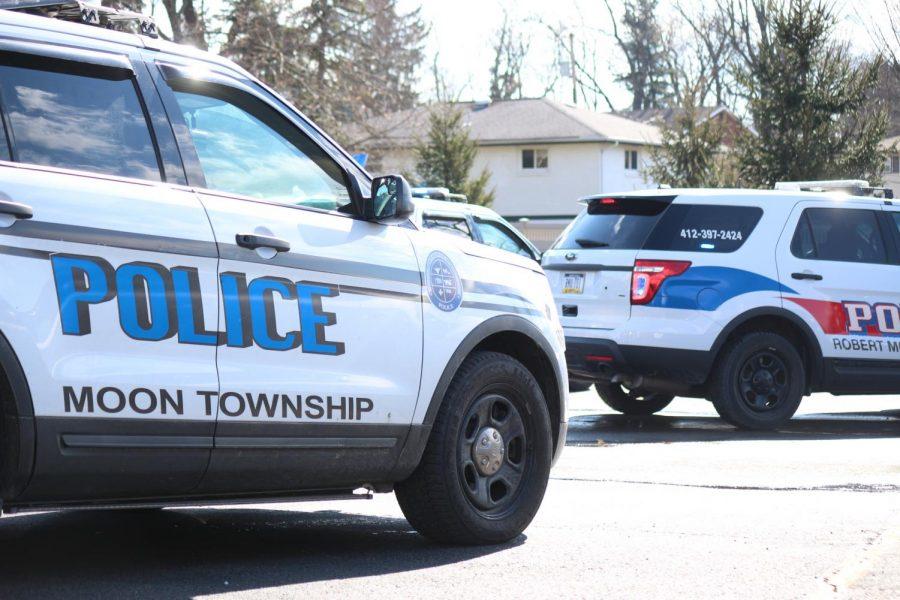 Moon Township and Robert Morris Police arrive in the parking lot of the Benjamin Rush Center.