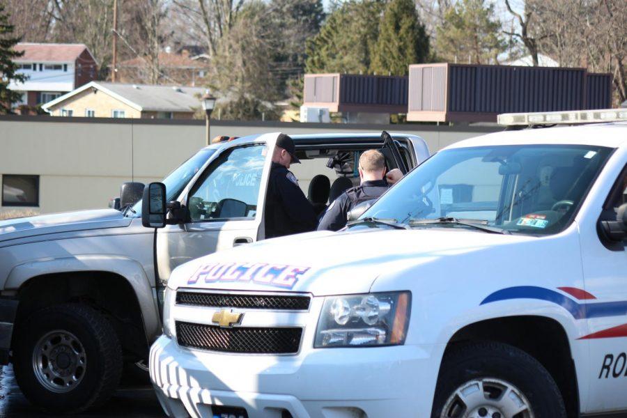 Moon Township and Robert Morris Police search a vehicle in the parking lot of the Benjamin Rush Center.