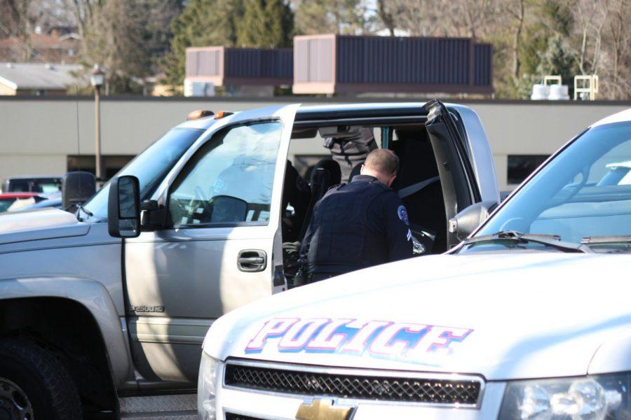 Moon Township and Robert Morris Police search a vehicle in the parking lot of the Benjamin Rush Center.