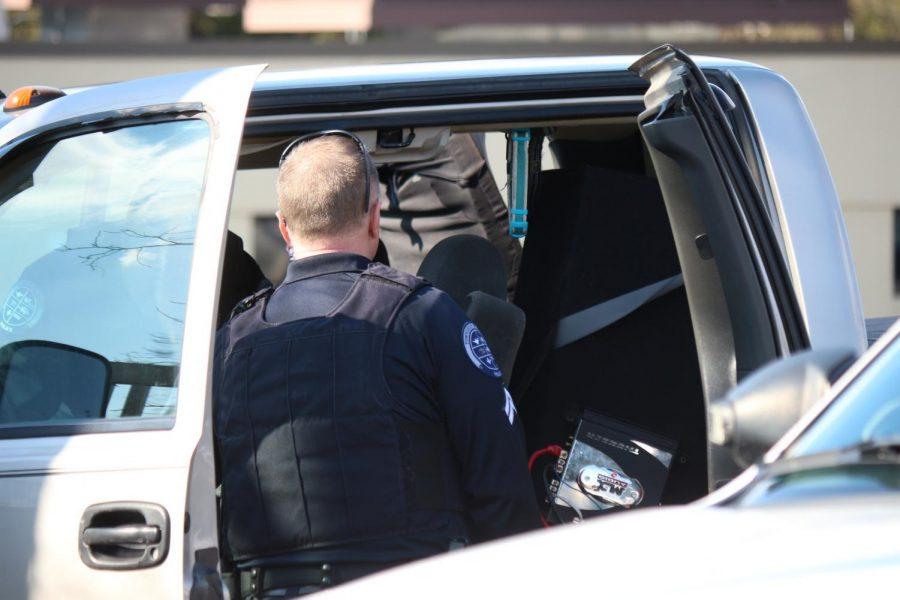 Moon Township and Robert Morris Police search a vehicle in the parking lot of the Benjamin Rush Center.