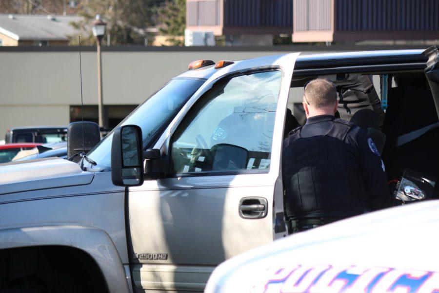 Moon Township and Robert Morris Police search a vehicle in the parking lot of the Benjamin Rush Center.