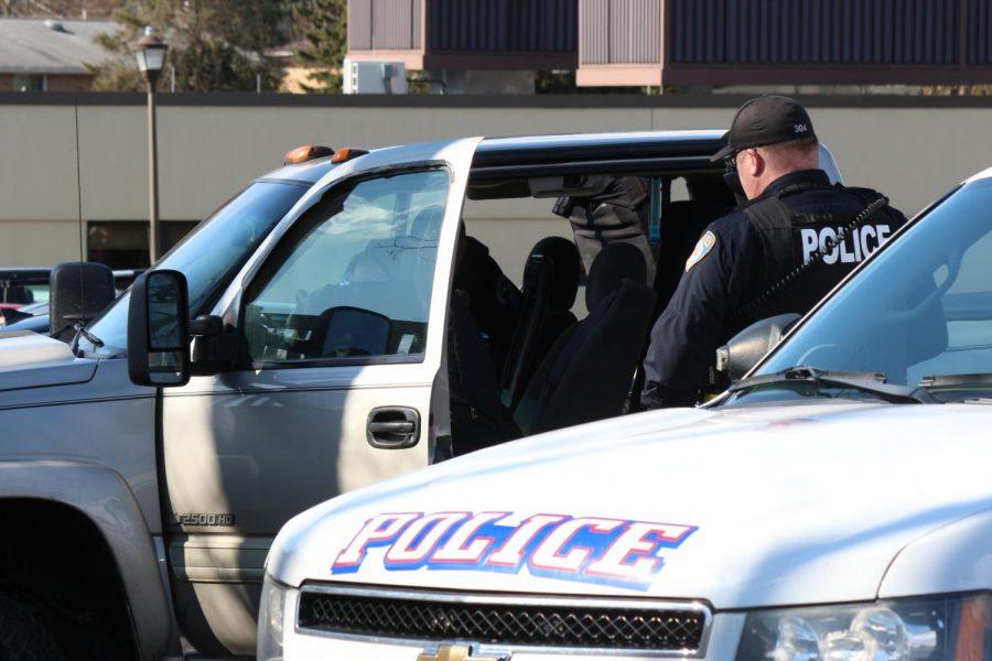 Moon Township and Robert Morris Police search a vehicle in the parking lot of the Benjamin Rush Center.