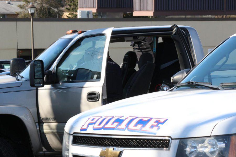 Moon Township and Robert Morris Police search a vehicle in the parking lot of the Benjamin Rush Center.