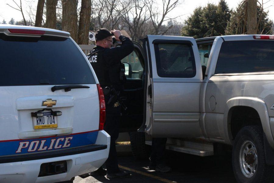 Moon Township and Robert Morris Police search a vehicle in the parking lot of the Benjamin Rush Center.