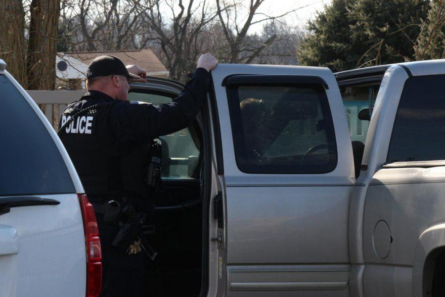 Moon Township and Robert Morris Police search a vehicle in the parking lot of the Benjamin Rush Center.