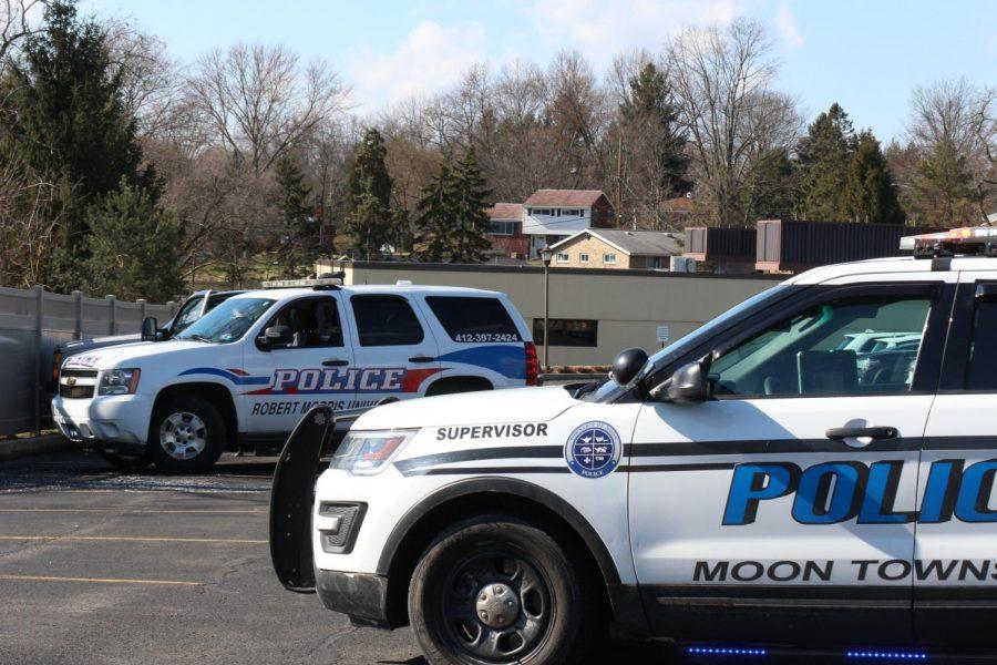 Moon Township and Robert Morris Police search a vehicle in the parking lot of the Benjamin Rush Center.