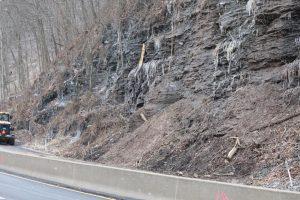 PennDOT crews work to clear a landslide that closed the southbound lanes of University Blvd. in Moon Twp. for nearly a week. 