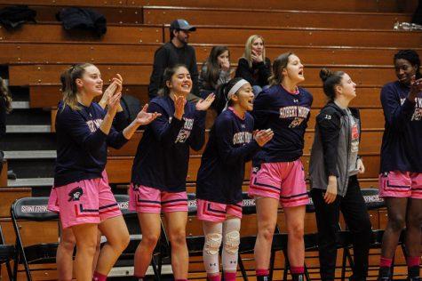 The bench celebrates after a Nina Augustin three-pointer. Loretto, PA Feb. 18, 2019. (RMU Sentry Media/Samuel Anthony)