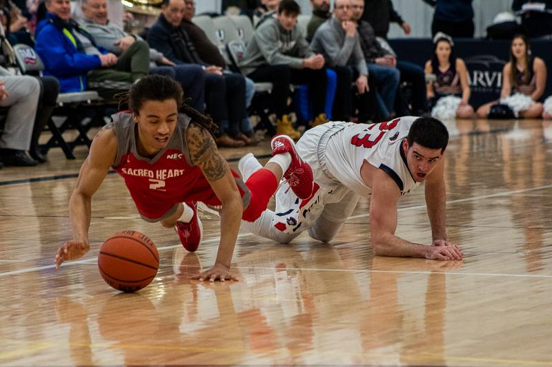 MOON TOWNSHIP -- Matty McConnell pounces on a loose ball against Sacred Heart (Sam Anthony/RMU Sentry Media).