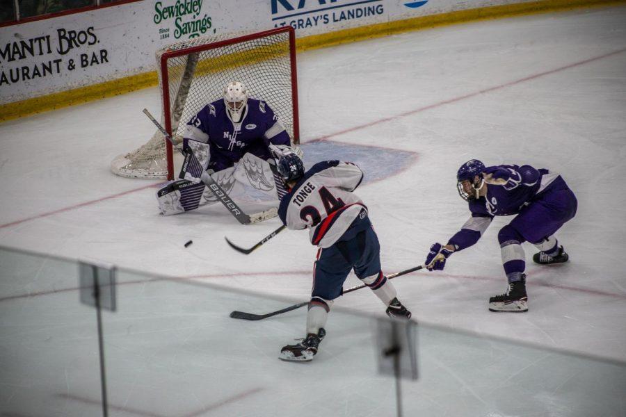 MOON TOWNSHIP -- Alex Tonge fires a slapshot against Niagara on November 2, 2018 (David Auth/RMU Sentry Media).