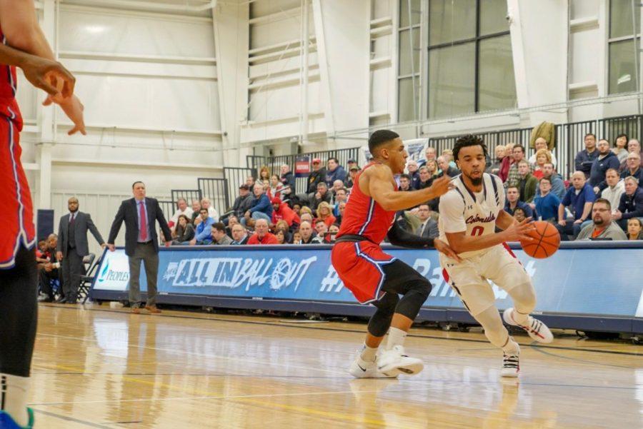 MOON TOWNSHIP -- Josh Williams drives to the hoop against Saint Francis Brooklyn on March 6, 2019 (Tim Kelly/RMU Sentry Media). Josh Williams had a game-high 21 points on the night.