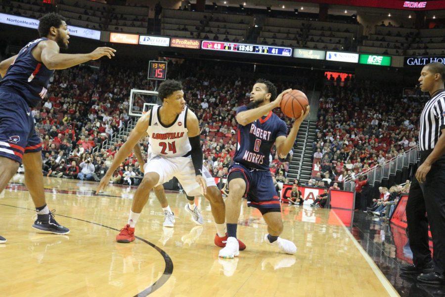 Josh Williams looks to pass against Louisville