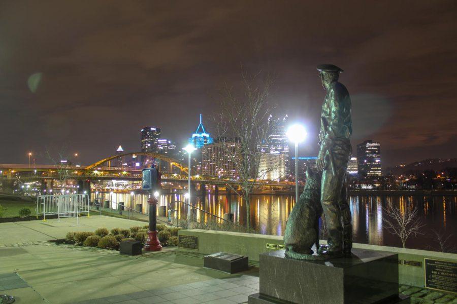 A monument of a police officer and their K9 dog watch over Downtown Pittsburgh from the Allegheny County Law Enforcement Officers Memorial on the North Shore. Photo Date: March 29, 2019 Photo Credit: (RMU Sentry Media/Gage Goulding)